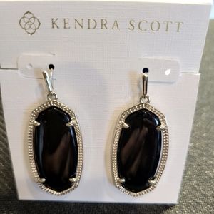 Kendra Scott Elle gold drop black opaque glass earrings.